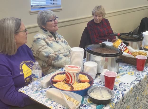 Volunteers serving chili