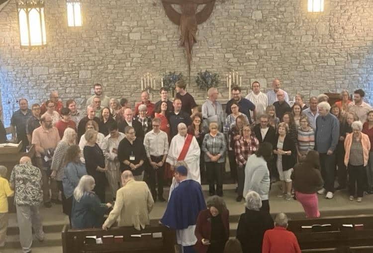 St. Thomas Episcopal Church clergy and congregation members during service.