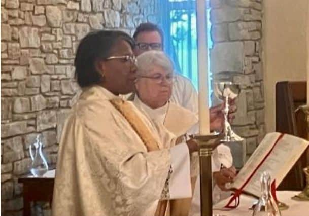St. Thomas Episcopal Church clergy and congregation members during service.